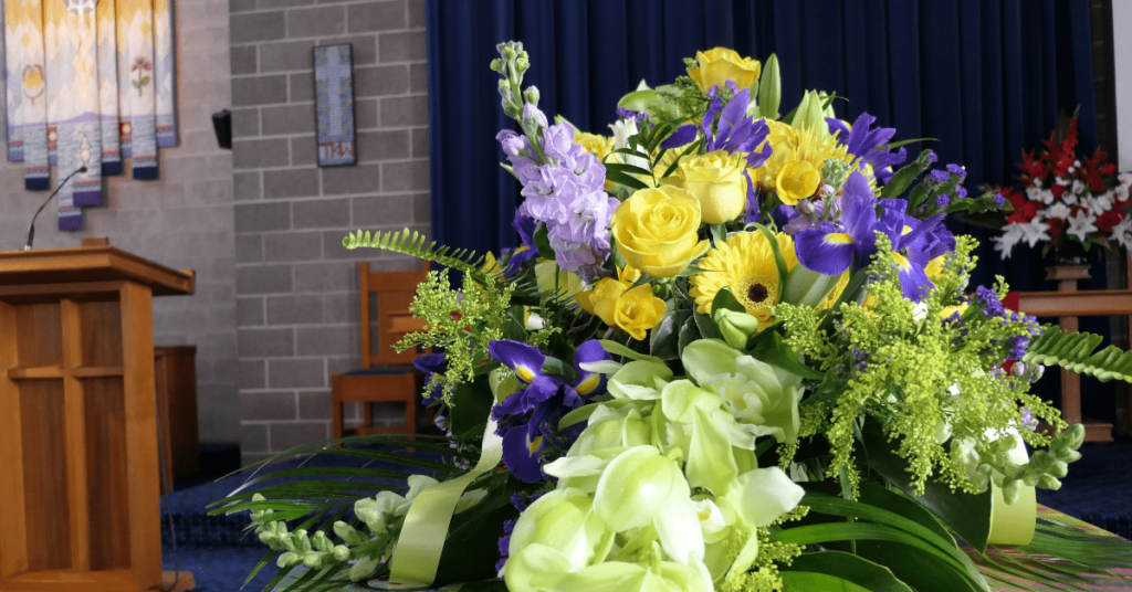 Flowers on a coffin at a funeral.